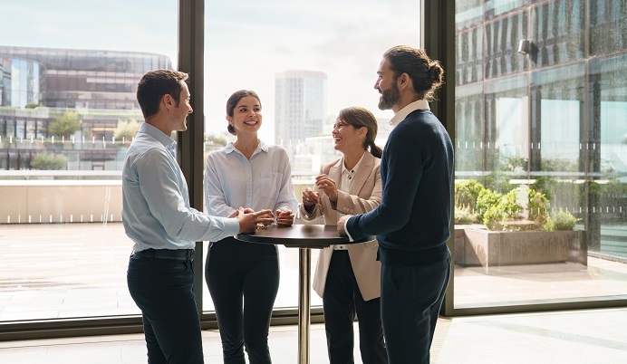 Coworkers around table in lobby